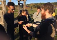 Nat Mengist and students sampling foods at Finn River Orchard