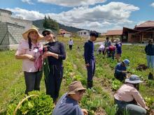 farmers and students working together in a field in Ecuador