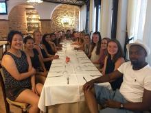 Students at dinner table in Sardinia