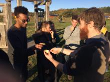 Nat Mengist and students sampling foods at Finn River Orchard