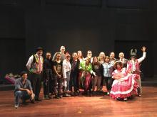 CHID Peru students and faculty on a stage with the Yuyachkani Cultural Group