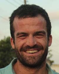 Willy Oppenheim's profile photo. Close head shot of Willy smiling, in a blue button-up shirt. 