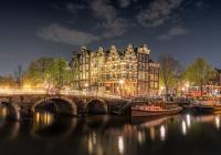 Amsterdam buildings, bridge, and canal at night