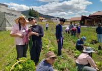 farmers and students working together in a field in Ecuador