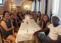 Students at dinner table in Sardinia